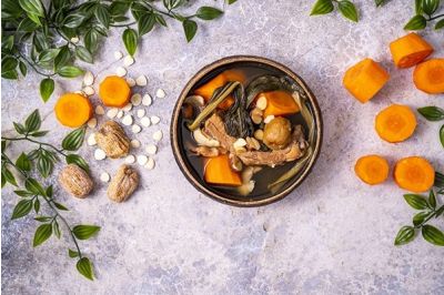 Chinese soup with meat, vegetables and dried herbs